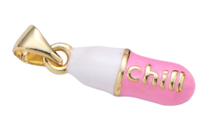 Pill charm that says "chill"