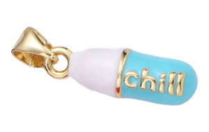Pill charm that says "chill"